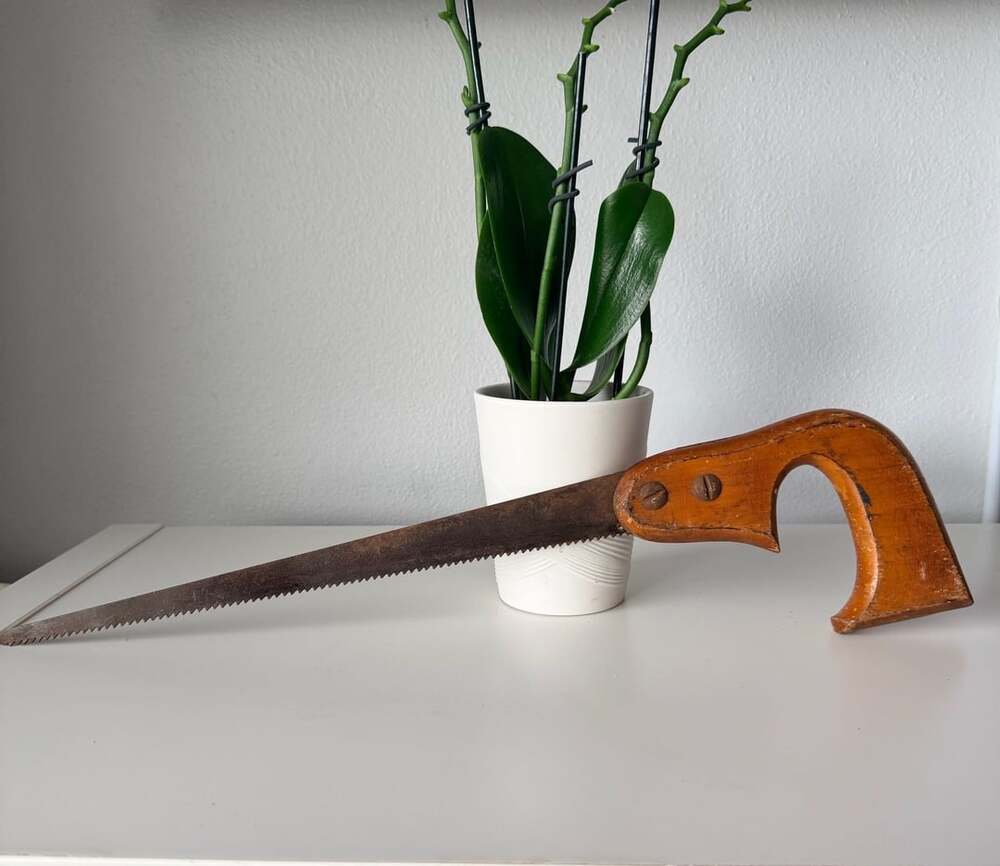 Vintage Keyhole Saw with Wooden Handle and Rusty Blade
